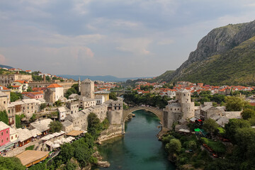 Fototapeta na wymiar A landscape view of the old town of Mostar, with the old bridge over the river