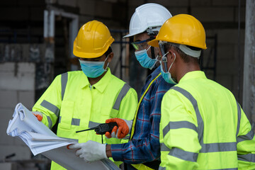 The construction engineering team of industrial factories, warehouses, is conducting quality checks of the construction work.