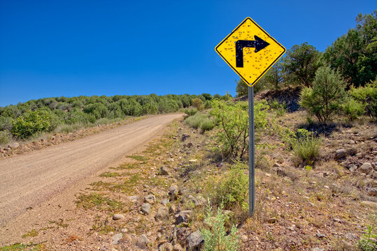 A sign along Forest Service Road 492 that has been shot up by reckless gunfire, Prescott National Forest, Arizona