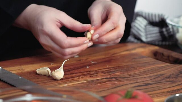 Step by step. Crushing garlic for beet soup, borscht.