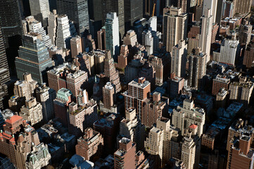 Abstract aerial view of the toy-like Manhattan, one of the most densely populated neighborhood in New York, featuring iconic skyscrapers, cultural and financial centers, famous avenues and shops, USA