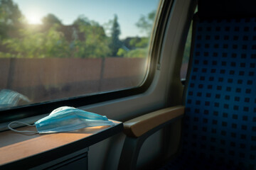 Empty inside train bus subway public transport with window view and blue seats people tourist new normal social distancing safe travel with hygiene face mask protect from covid corona virus