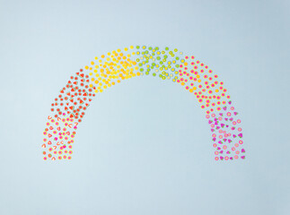 Rainbow of toy fruit on a blue background. Minimal concept. Creative idea.