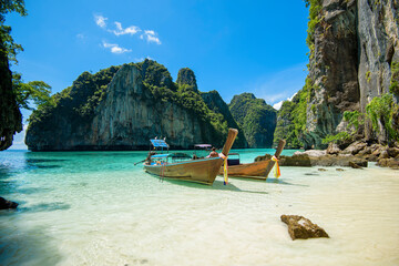 Fototapeta na wymiar View of thai traditional longtail Boat over clear sea and sky in the sunny day, Phi phi Islands, Thailand