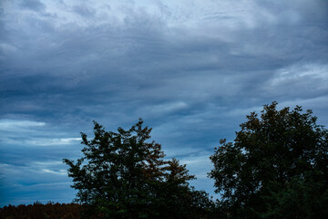 Fototapeta na wymiar Landscape beautiful dark evening sky with clouds in the countryside