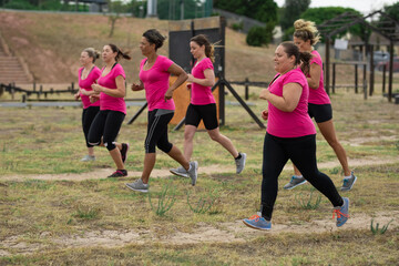 Group of woman running at boot camp