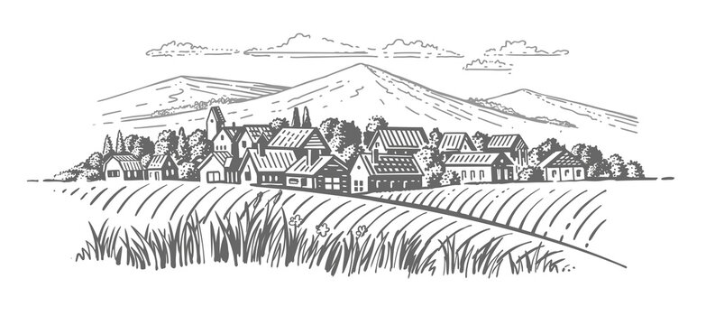 large village with fields en mountains background