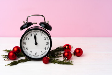 Christmas and New Year countdown concept with alarm clock