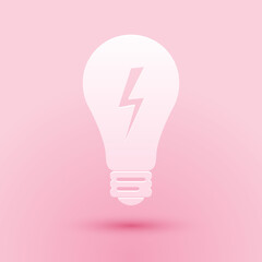 Fototapeta premium Paper cut Light lamp sign. Bulb with lightning symbol icon isolated on pink background. Idea symbol. Paper art style. Vector.