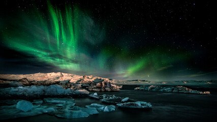 aurora borealis over the glacial lake with icebergs - obrazy, fototapety, plakaty