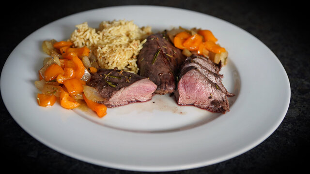ready to eat - roasted fillet from a red deer calf with onions and parika