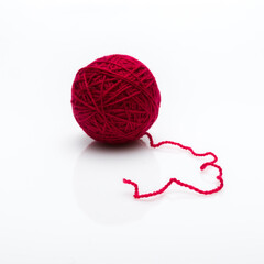 red yarn thread isolated on white background