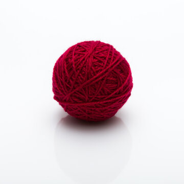 Ball Of Red Yarn Yarn On White Background