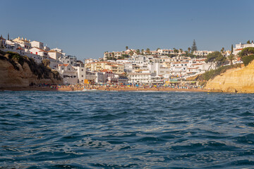 Carvoeiro village and beach, view from seashore, in Algarve tourism destination region, Portugal.
