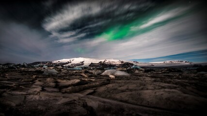 storm clouds over the mountains aurora borealis