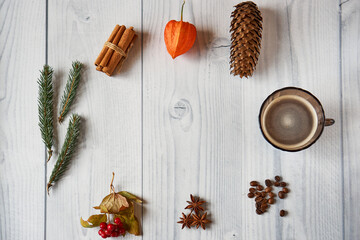 Christmas composition. Round frame made of winter things on a white wooden background with copy space for text. The concept of winter holidays, comfort. Photo for bloggers. Flat lay. Top view.