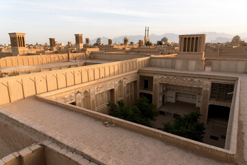 Fototapeta premium Views of the skyline with minarets and domes of Yazd at sunset, Iran