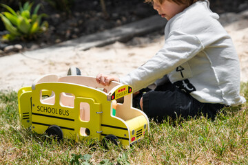 Child playing with a toy outside