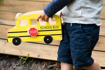Child playing with a toy outside