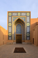 Big Mosque with tall minarets in Yazd at sunset, Iran