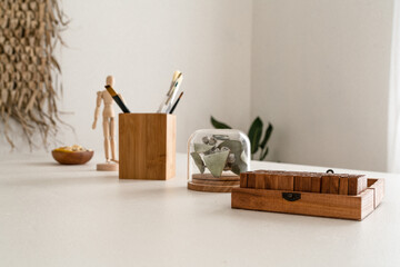 Modern wooden objects in a white workspace on a table