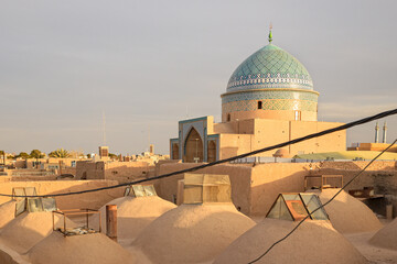 Views of the skyline with minarets and domes of Yazd at sunset, Iran