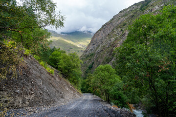 Fototapeta na wymiar Dirt road in the mountains of Upper Khevsureti, Georgia