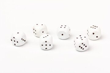 White gamble dice with black dots, isolated on white background.