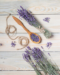 Obraz na płótnie Canvas Bunch of dried lavender on wooden background. Top view.