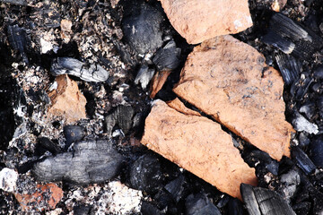 cracked bricks after a fire. cracks, coal