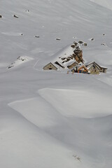Skiing in the snow covered mountains of the San Domenico Ski Resort in Alps in Northern Italy