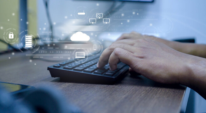 close up computer programmer man hand typing on keyboard for transfer or synch data upload and download from cloud computing with virtual interface in operation room, technology business concept