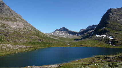 A beautiful lake surrounded by mountains in a mountain range of Norway.