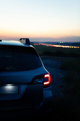 Obraz na płótnie Canvas car taillights at night time. city lights on background