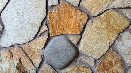 Masonry on the wall and floor. Various stone textures. Multicolored background.