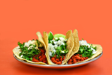 Three delicious mexican vegan tacos with coriander.