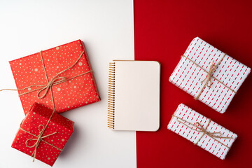Beautiful red and white composition with Christmas gifts