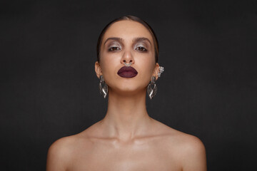 Caucasian girl model with perfect makeup and suntanned skin, big eyes and lips, jewelry in ears,...