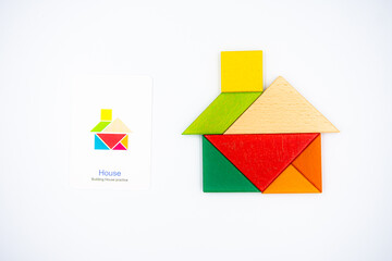 Color wood tangram puzzle in House shape on white background