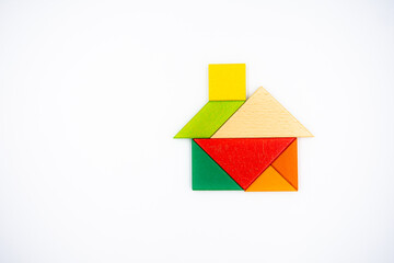 Color wood tangram puzzle in House shape on white background