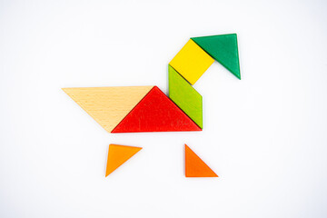 Color wood tangram puzzle in Duck shape on white background