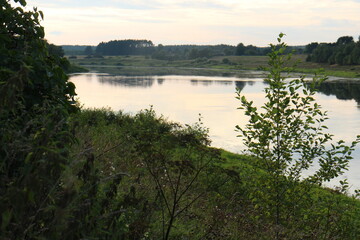 Fototapeta na wymiar View of the river in the countryside at sunset