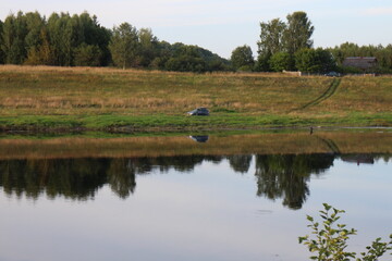 View of the river in the countryside at sunset