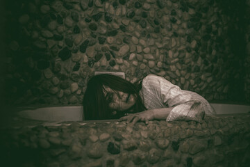 Portrait of asian woman make up ghost face with blood,Horror scene,Scary background,Halloween...