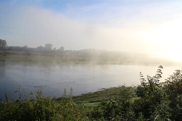 View of the misty river from the morning in summer
