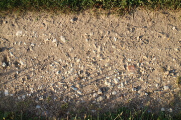 stones on the village road in summer in the village