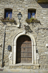 The entrance door to an old house of Guardia Perticara, a village in the mountains of the Basilicata region, Italy.