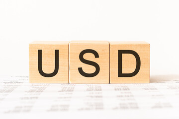 Word USD. Wooden small cubes with letters isolated on white background with copy space available.Business Concept image.
