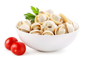 Dumplings in a plate with a leaf of parsley and tomatoes on a white background. Isolated