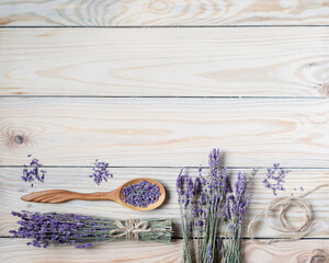 Bunch of dried lavender on wooden background. Top view, copyspace.